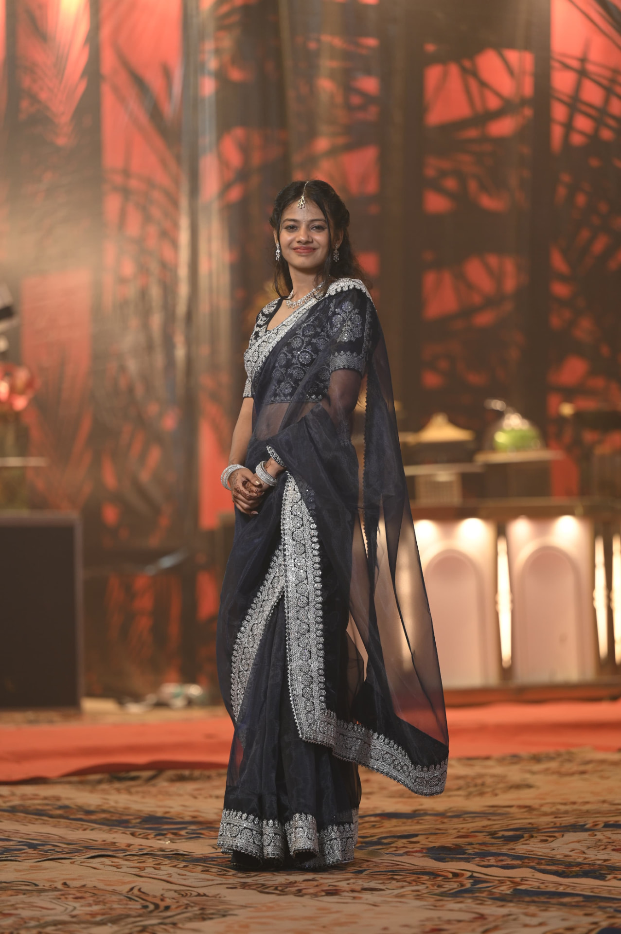Achintya in a navy embroidered saree